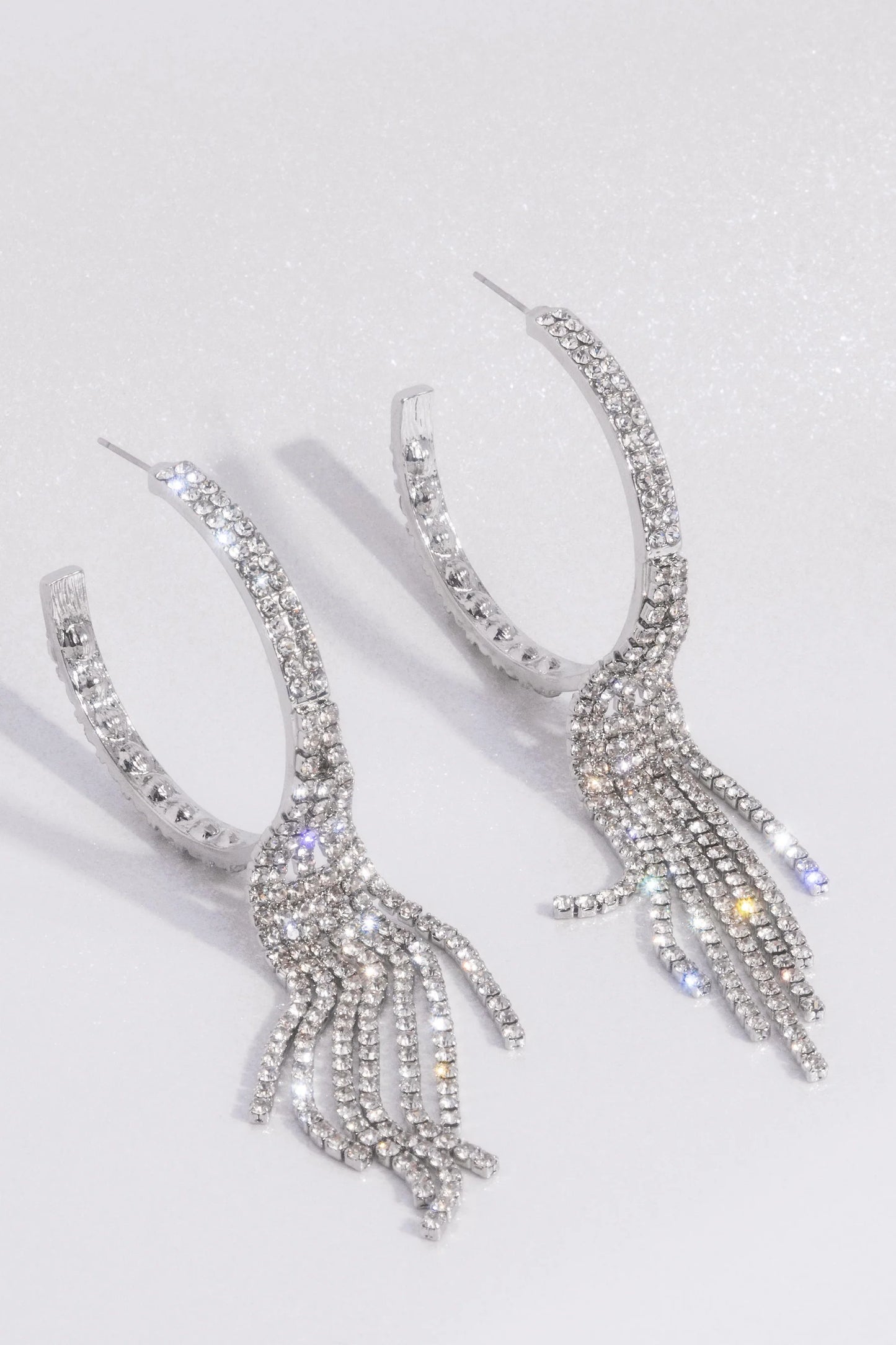 Jaw-Dropping Jubilee - White Rhinestone Tassel Paparazzi Hoop Earrings - September 2024 LOP