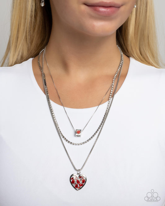 Seize the Sides - Red/White Rhinestone Embellished Heart Pendant Paparazzi Necklace & matching earrings