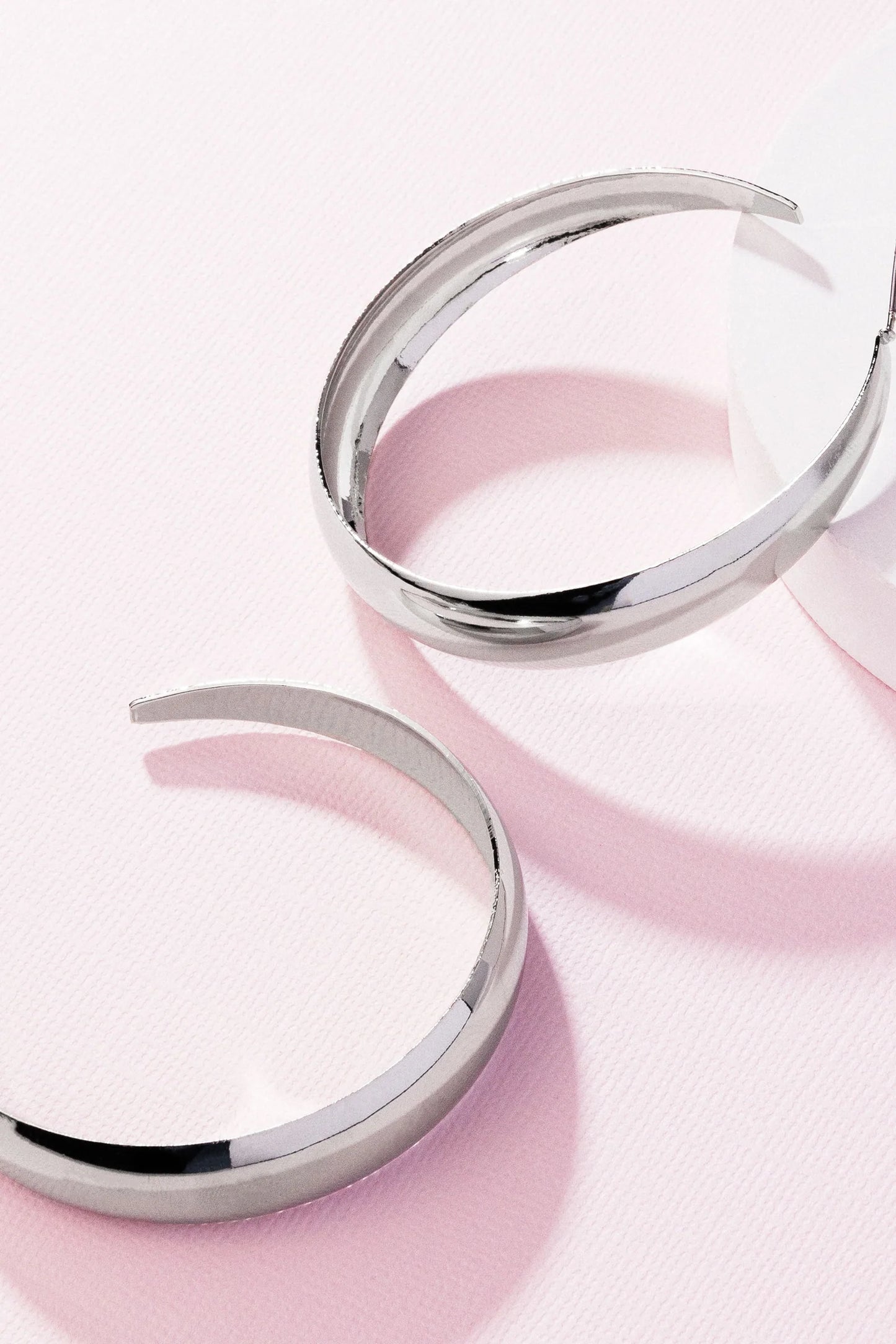 Gravity Generosity - Silver Oversized Hoop Paparazzi Earrings
