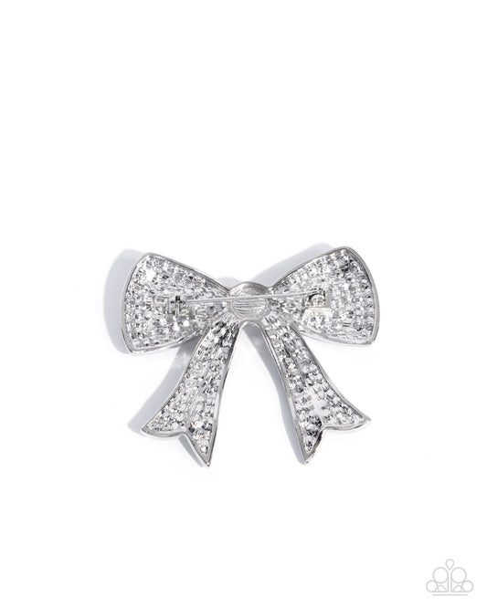 Bow Bravado - White Rhinestone Embellished Silver Bow Paparazzi Brooch