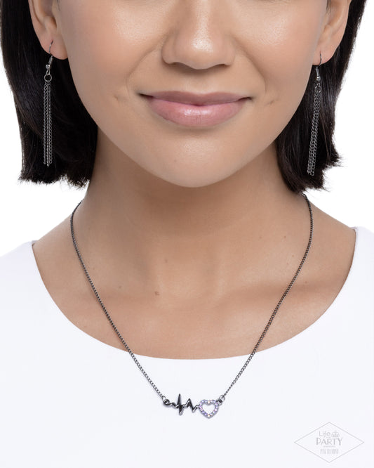 HEARTBEAT Street - Purple Rhinestone Embellished Heart/Gunmetal Wavy Bar Paparazzi Necklace & matching earrings