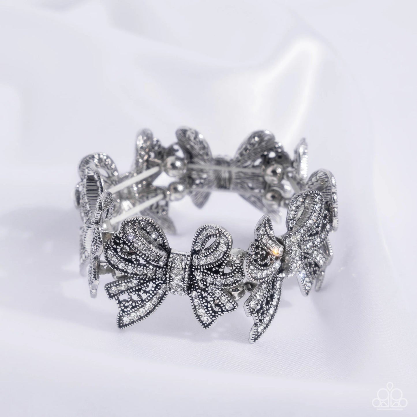 French Flourish - White Rhinestone Embellished Silver Airy Bows Paparazzi Stretch Bracelet