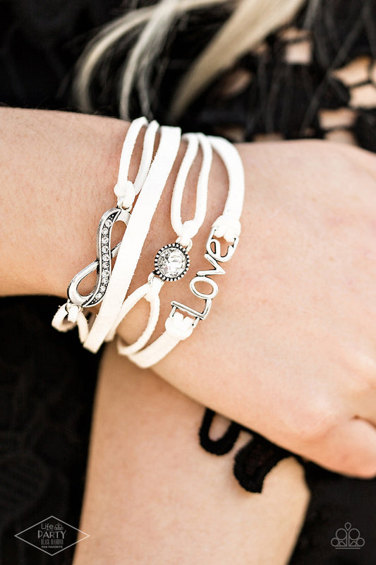 Infinitely Irresistible - White Suede, Infinity Charm, White Rhinestone, & "Love" Charm Paparazzi Adjustable Bracelet