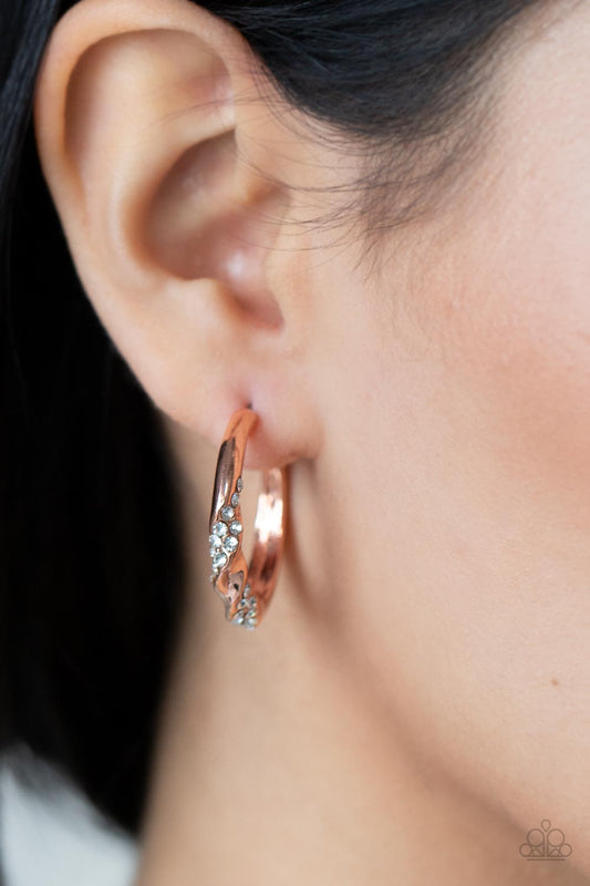 Subliminal Shimmer - Copper & White Rhinestone Ribbon Paparazzi Hoop Earrings