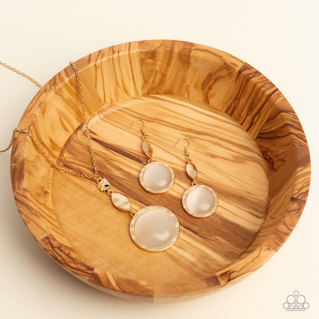 Magic Carpet Cruise - Gold Hammered Frame/Oversized White Cats Eye Pendant Paparazzi Necklace & matching earrings