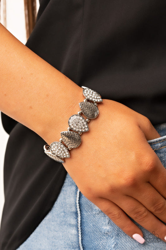 Playing Favorites - White Rhinestone & Silver Hammered Teardrop Paparazzi Stretch Bracelet