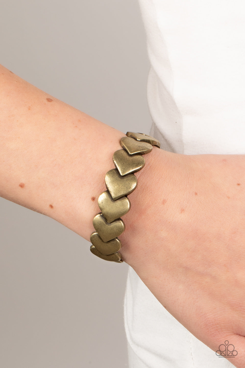 Hearts Galore - Brass Oversized Overlapping Hearts Paparazzi Cuff Bracelet