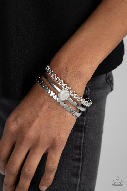 You Win My Heart - White Cats Eye' Heart & Silver Interlocking Hearts Paparazzi Cuff Bracelet