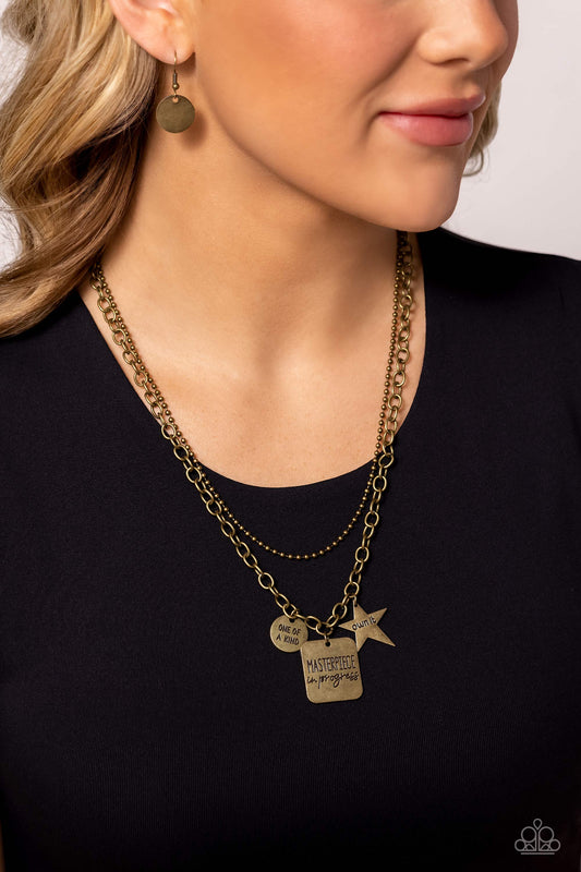 Masterpiece in Progress - Brass "Masterpiece in Progress" Stamped Pendant Paparazzi Necklace & matching earrings