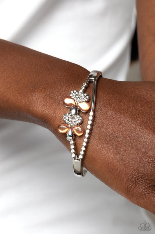 Broadway Stage - Orange Cat's Eye & White Rhinestone Flower Paparazzi Cuff Bracelet