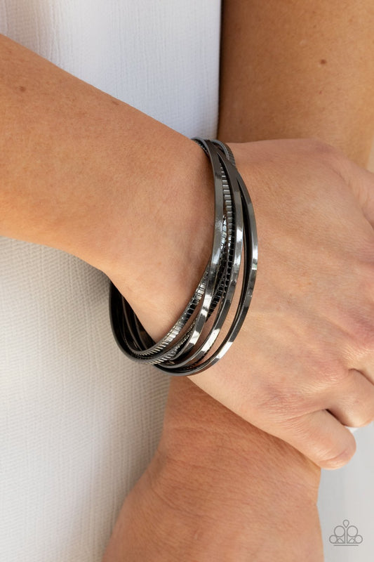 Trending Tread - Gunmetal Set of 4 Paparazzi Bangle Bracelets
