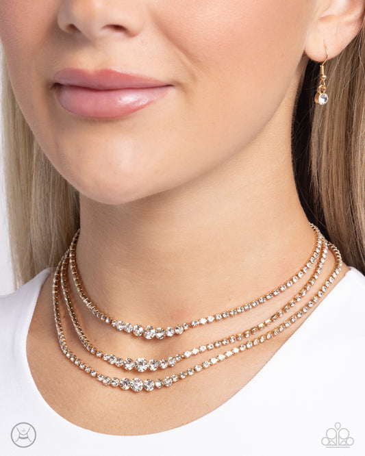 Dynamite Debut - Gold Fittings/White Rhinestone Paparazzi Necklace & matching earrings