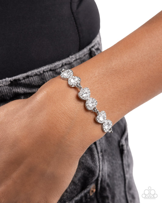 Angelic Afterlife - White Rhinestone Dusted Silver Bows Paparazzi Bracelet