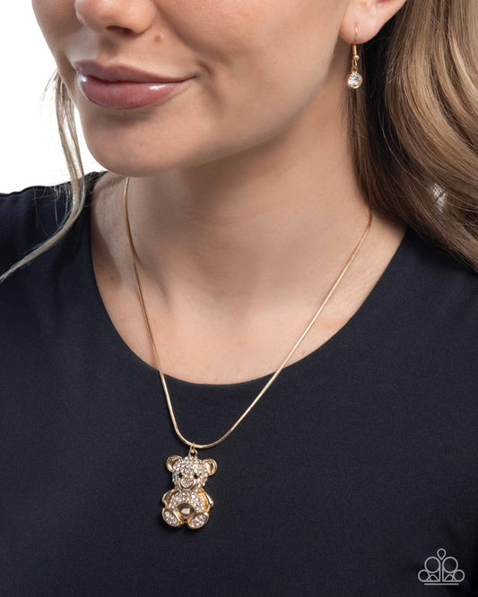 Cuddly Chic - Gold/Incandescent White Rhinestone Encrusted Bear Pendant Paparazzi Necklace & matching earrings