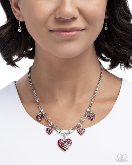 Affectionate Accuracy - Red Rhinestone Embellished Hearts Paparazzi Necklace & matching earrings