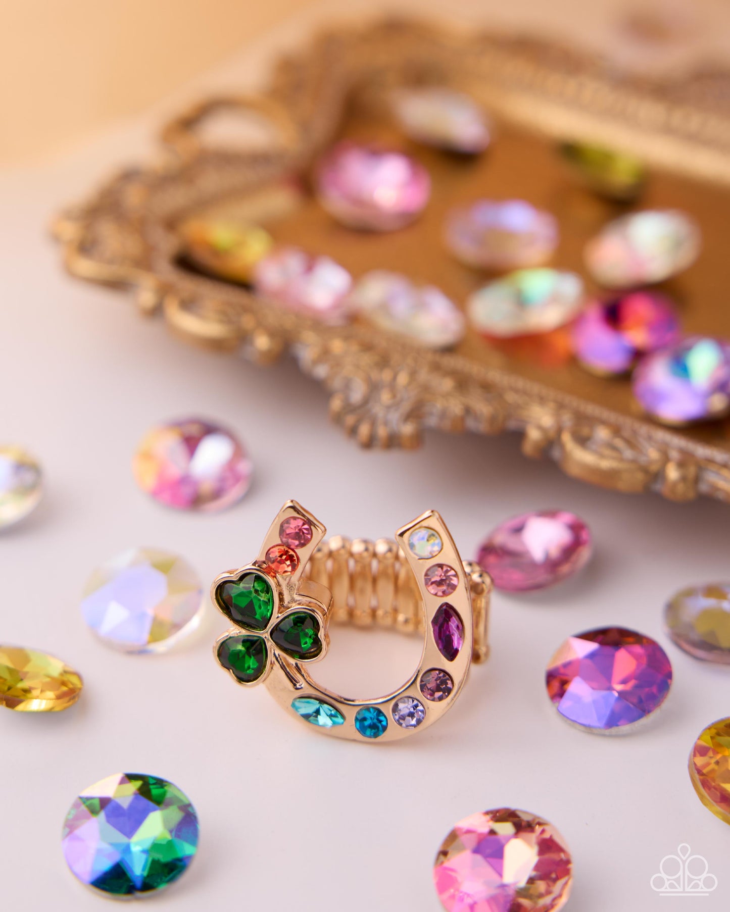 Lucid Luck - Multicolored Rhinestone Embellished Gold Horseshoe & Green Gem Clover Paparazzi Ring