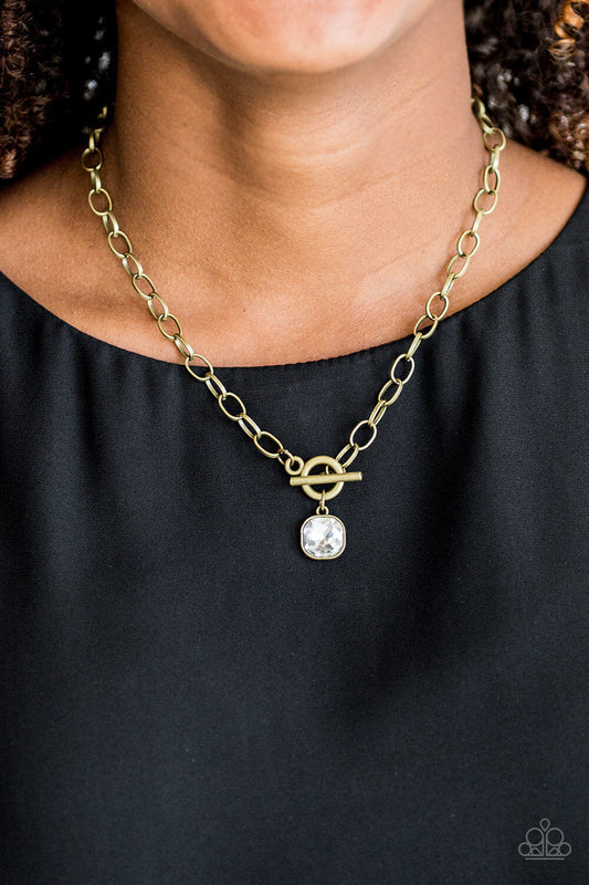 Dynamite Dazzle - Brass Chain/White Gem Pendant Paparazzi Toggle Necklace & matching earrings