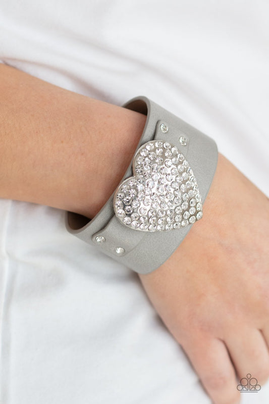 Flauntable Flirt - Silver/Gray Leather Band & White Rhinestone Oversized Heart Paparazzi Snap Bracelet