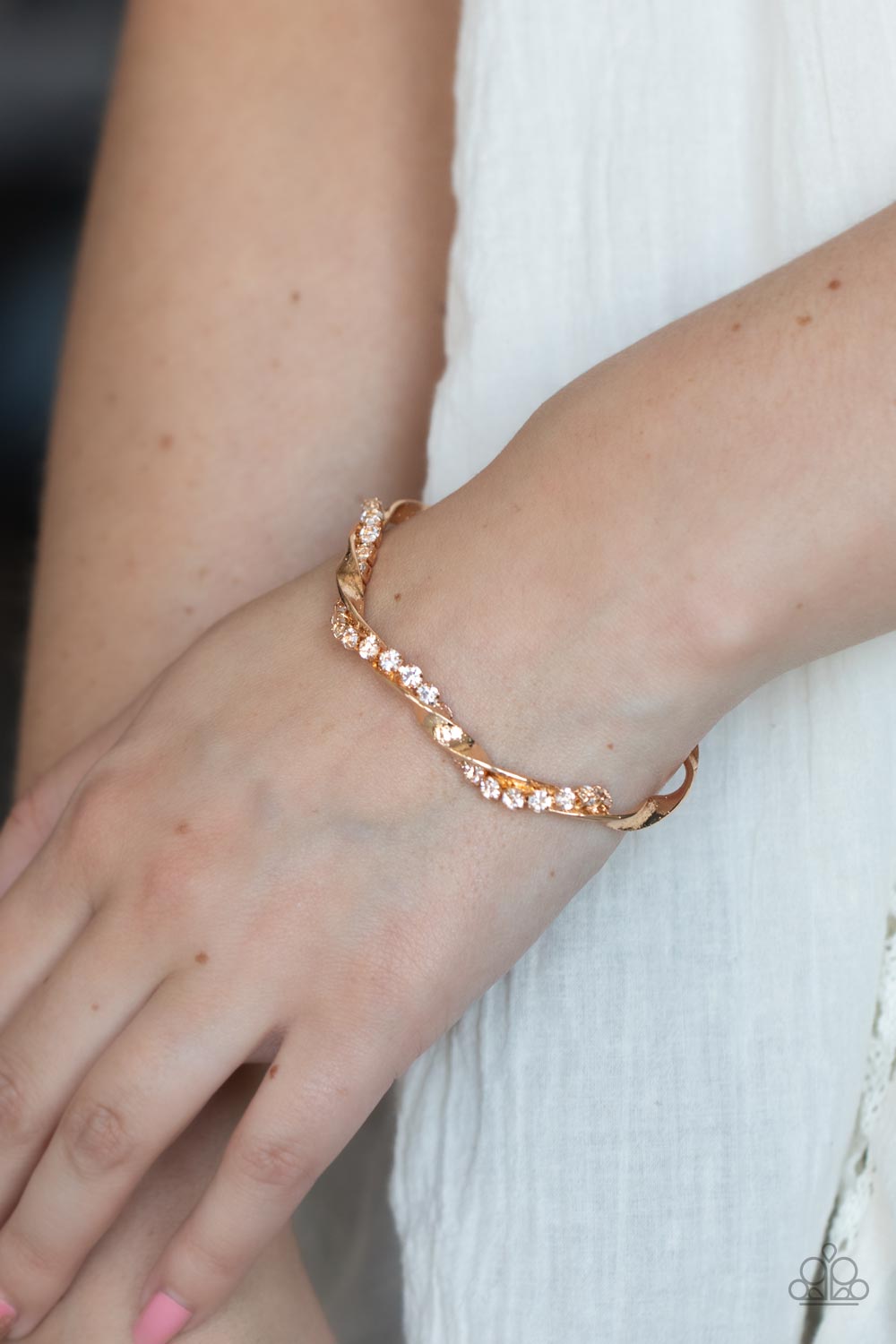 Twisted Twinkle - Gold & White Rhinestone Twisted Bar Paparazzi Cuff Bracelet