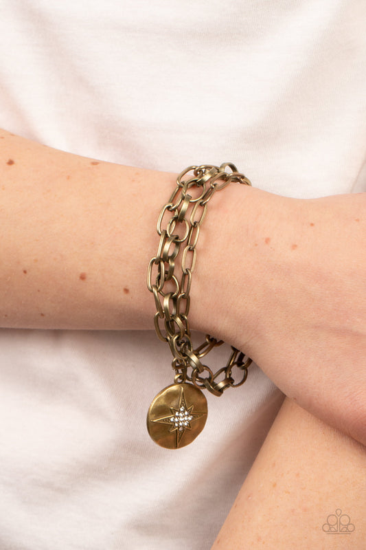 True North Twinkle - Brass Hammered Disc, White Rhinestones, & Brass Star Paparazzi Adjustable Bracelet