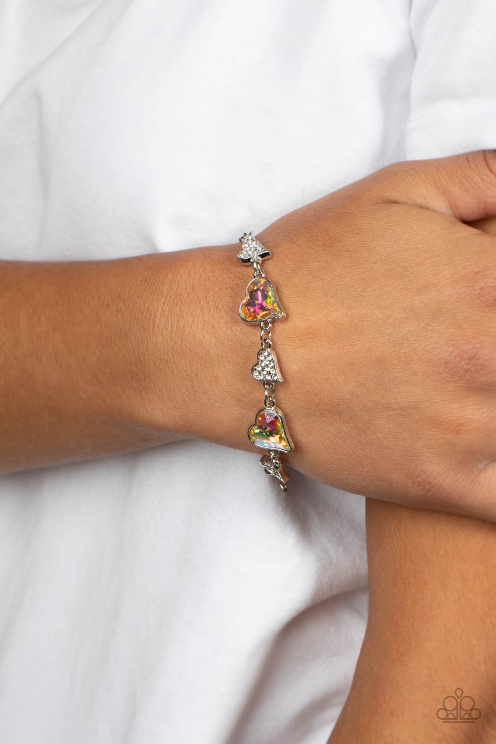 Cluelessly Crushing - Multi Iridescent Heart Gems, Silver Hearts, & White Rhinestone Paparazzi Adjustable Bracelet