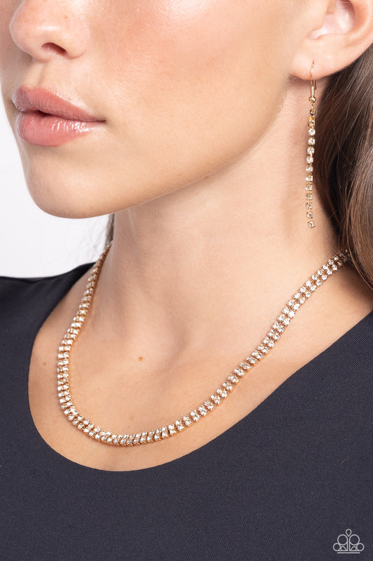 Dazzling Declaration - Gold Fittings/White Rhinestones Paparazzi Necklace & matching earrings