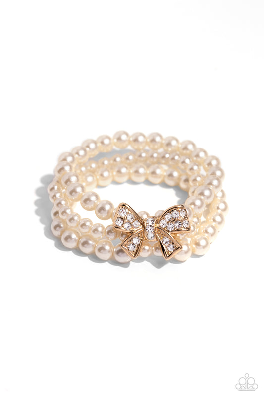 How Do You Do? - Gold Bow & White Pearl Paparazzi Stretch Bracelet